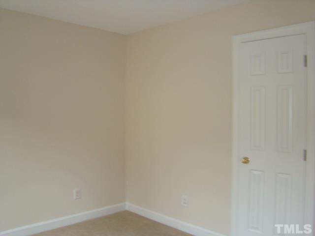 5504 Crossfield Drive Raleigh, NC 27613 - Photo 14 of 18 a small space with a white wall