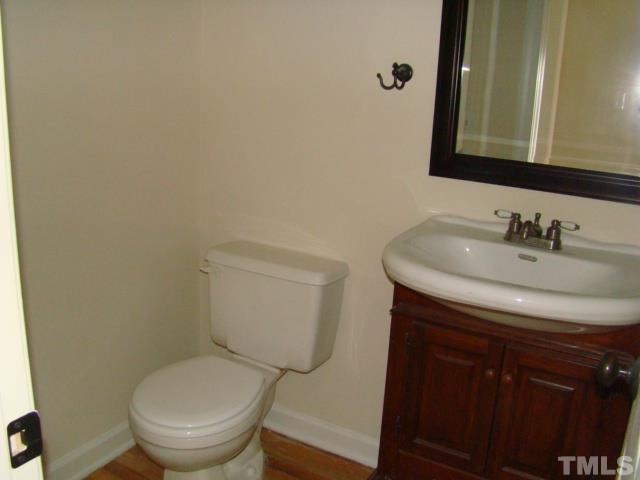 5504 Crossfield Drive Raleigh, NC 27613 - Photo 18 of 18 a bathroom with a sink and a toilet