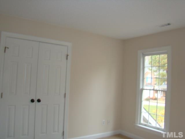 5504 Crossfield Drive Raleigh, NC 27613 - Photo 10 of 18 a view of an empty room with a window