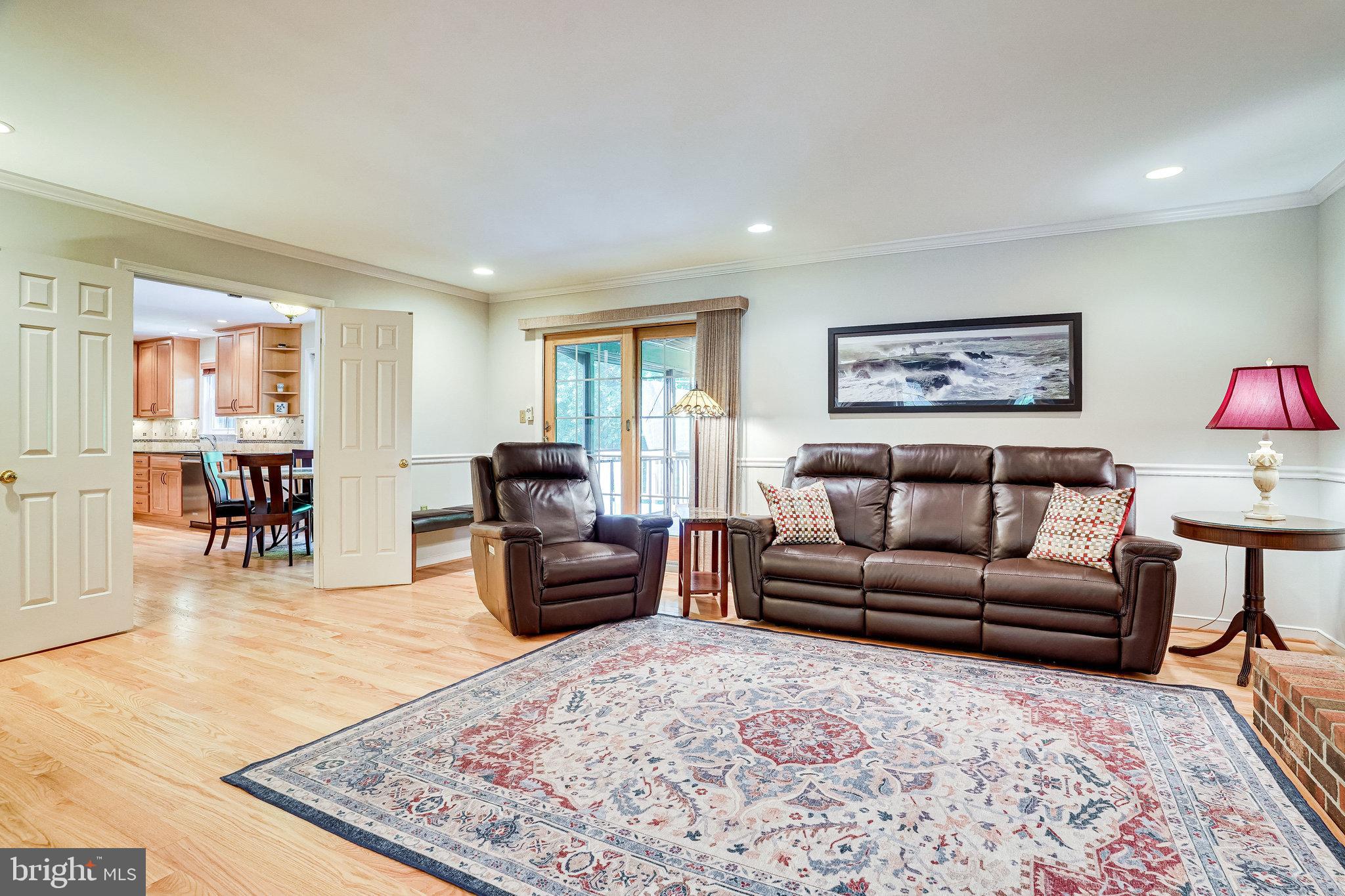 10319 Yellow Pine Drive Vienna, VA 22182 - Photo 8 of 56 Family room open to Kitchen and screened Porch