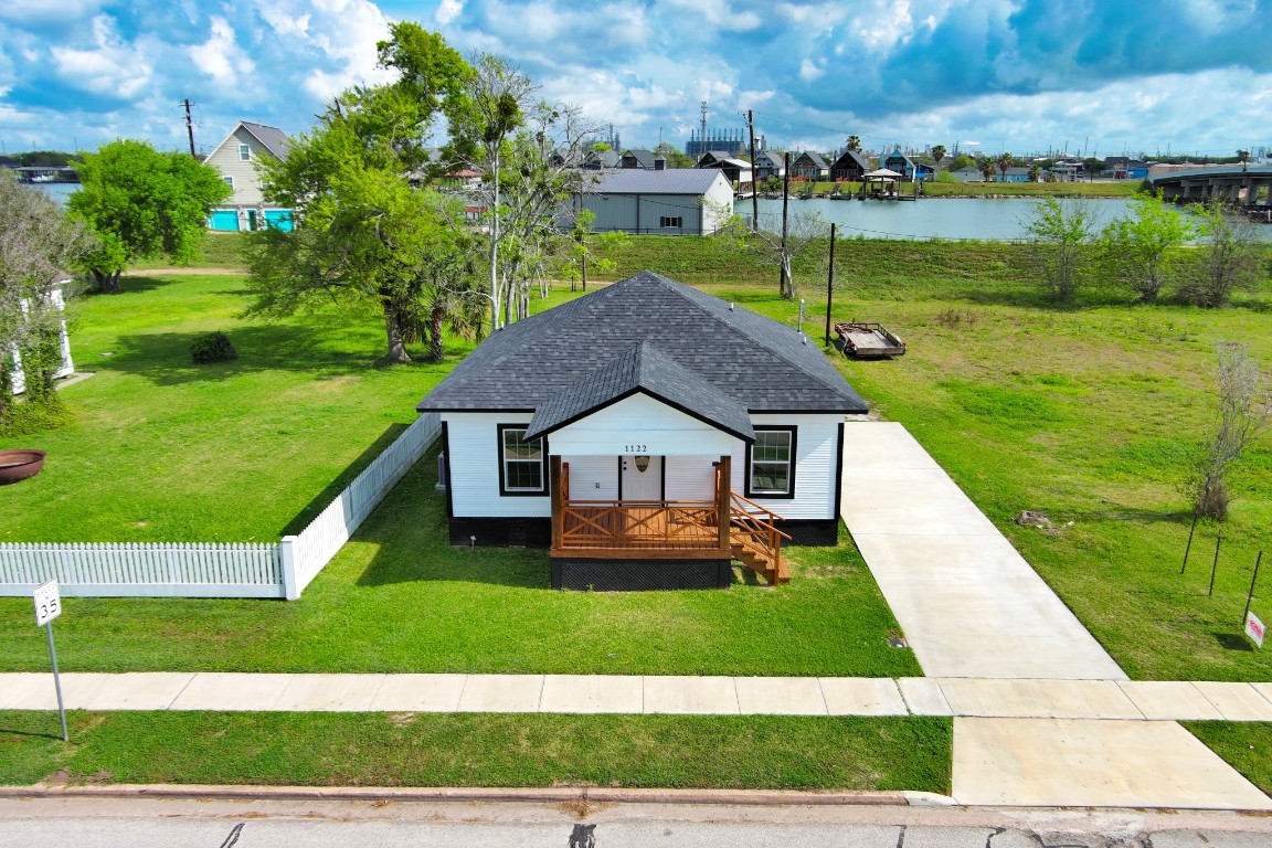1122 West 2nd Street Freeport, TX 77541 - Photo 1 of 38 a front view of a house with a yard