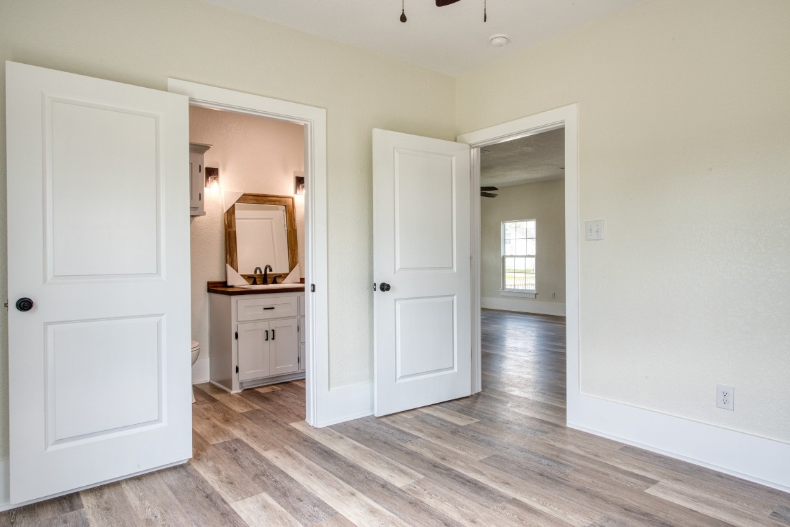 1122 West 2nd Street Freeport, TX 77541 - Photo 20 of 38 wooden floor in an empty room