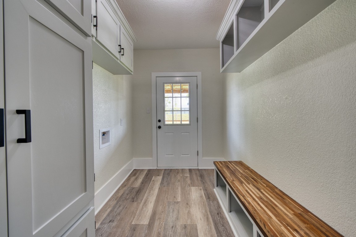1122 West 2nd Street Freeport, TX 77541 - Photo 24 of 38 a view of a room with wooden floor and staircase