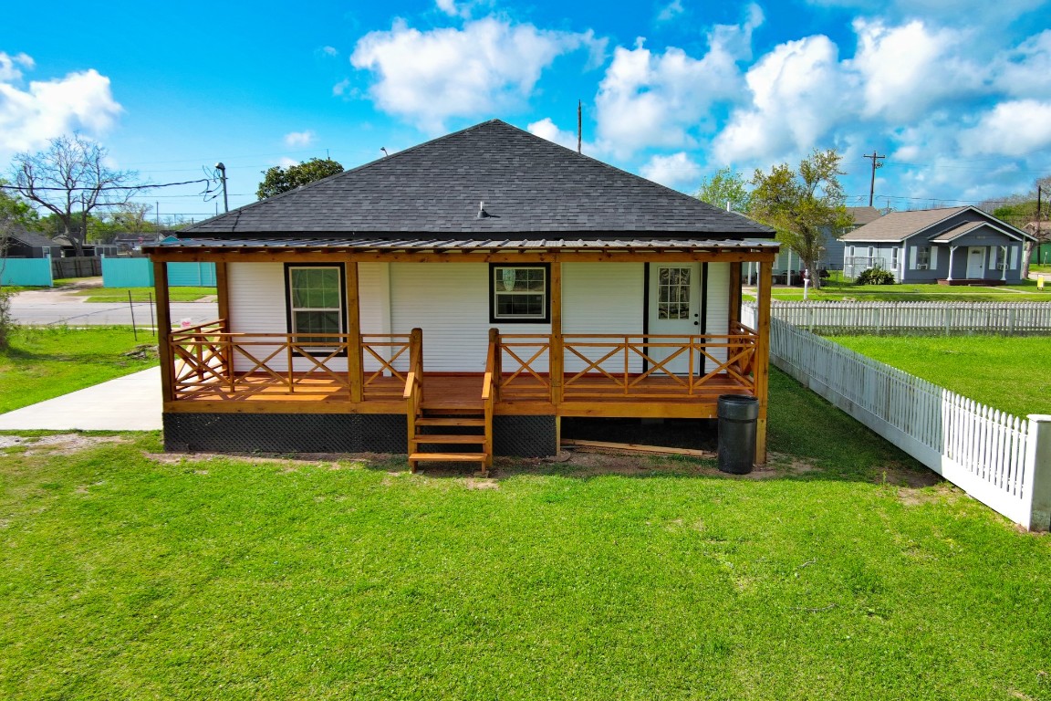 1122 West 2nd Street Freeport, TX 77541 - Photo 28 of 38 a view of a house with a yard and sitting area