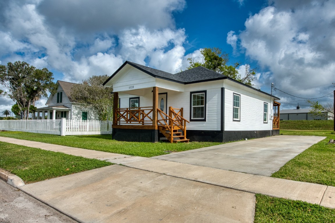1122 West 2nd Street Freeport, TX 77541 - Photo 3 of 38 a view of a house with a patio