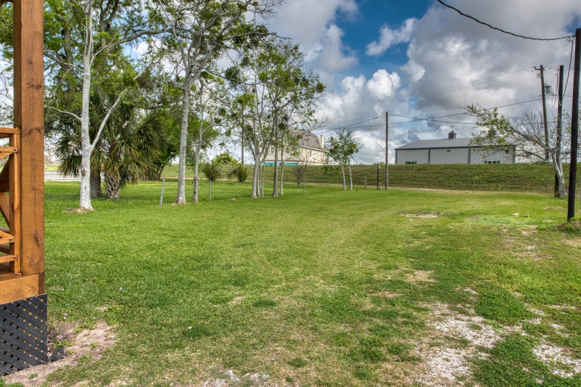 1122 West 2nd Street Freeport, TX 77541 - Photo 31 of 38 a view of a park with large trees