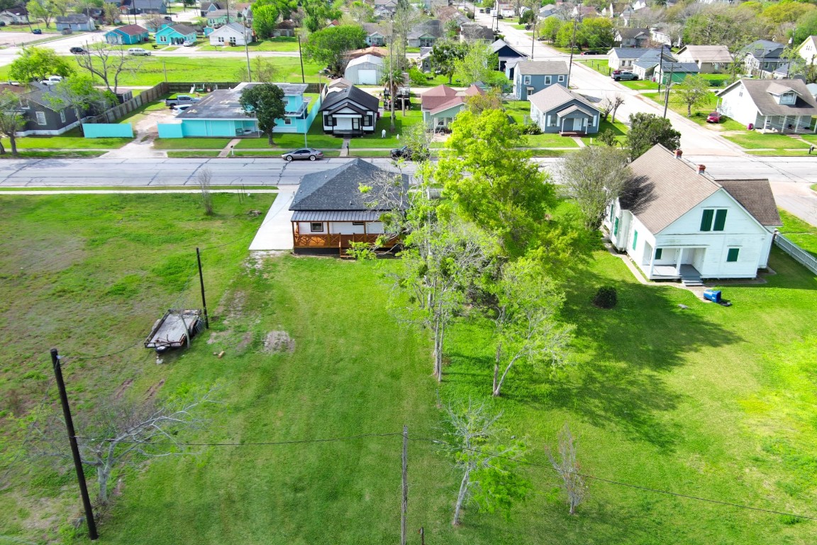 1122 West 2nd Street Freeport, TX 77541 - Photo 37 of 38 an aerial view of a house with a garden and houses