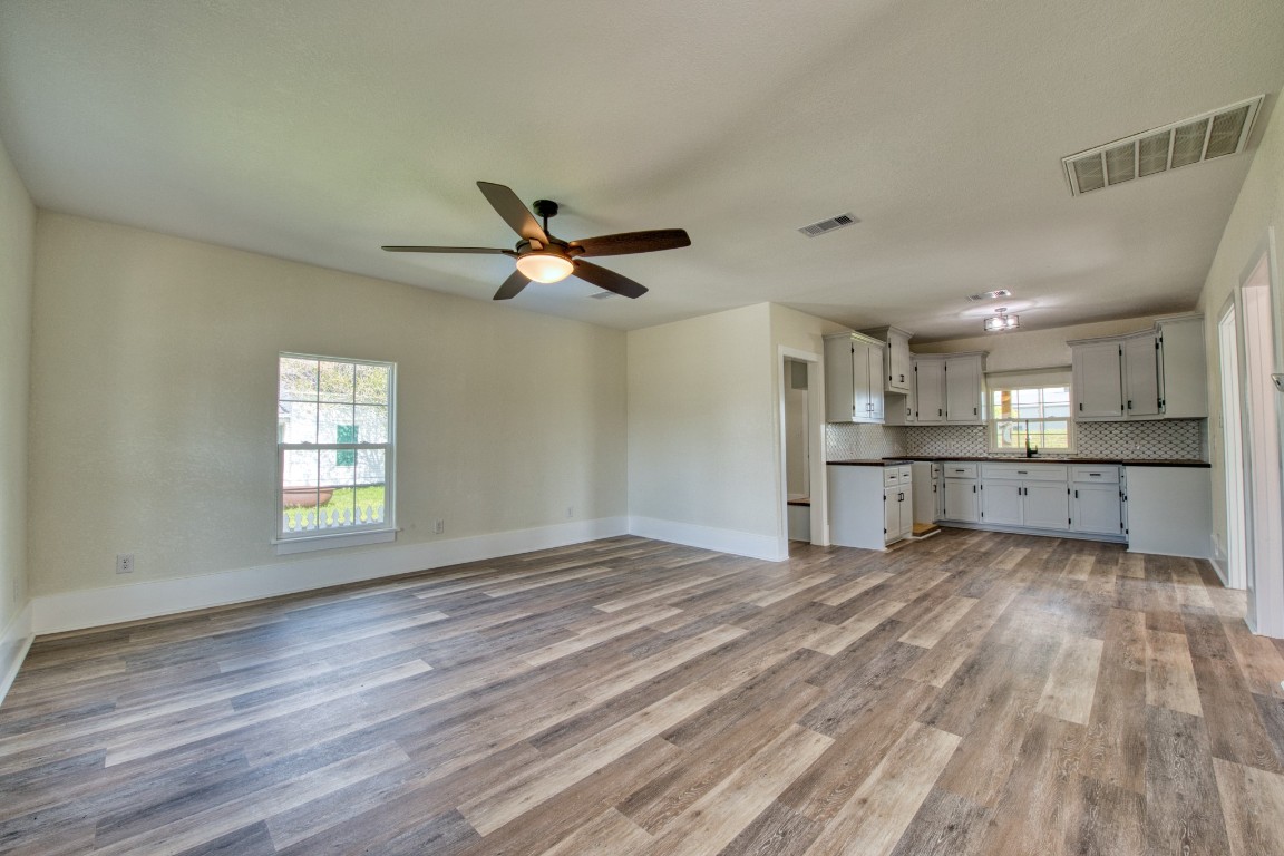 1122 West 2nd Street Freeport, TX 77541 - Photo 6 of 38 a view of a kitchen with wooden floor and a kitchen