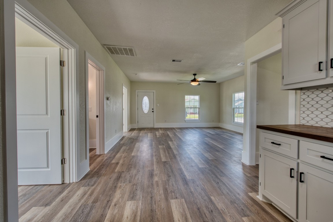 1122 West 2nd Street Freeport, TX 77541 - Photo 10 of 38 a view of hallway with wooden floor