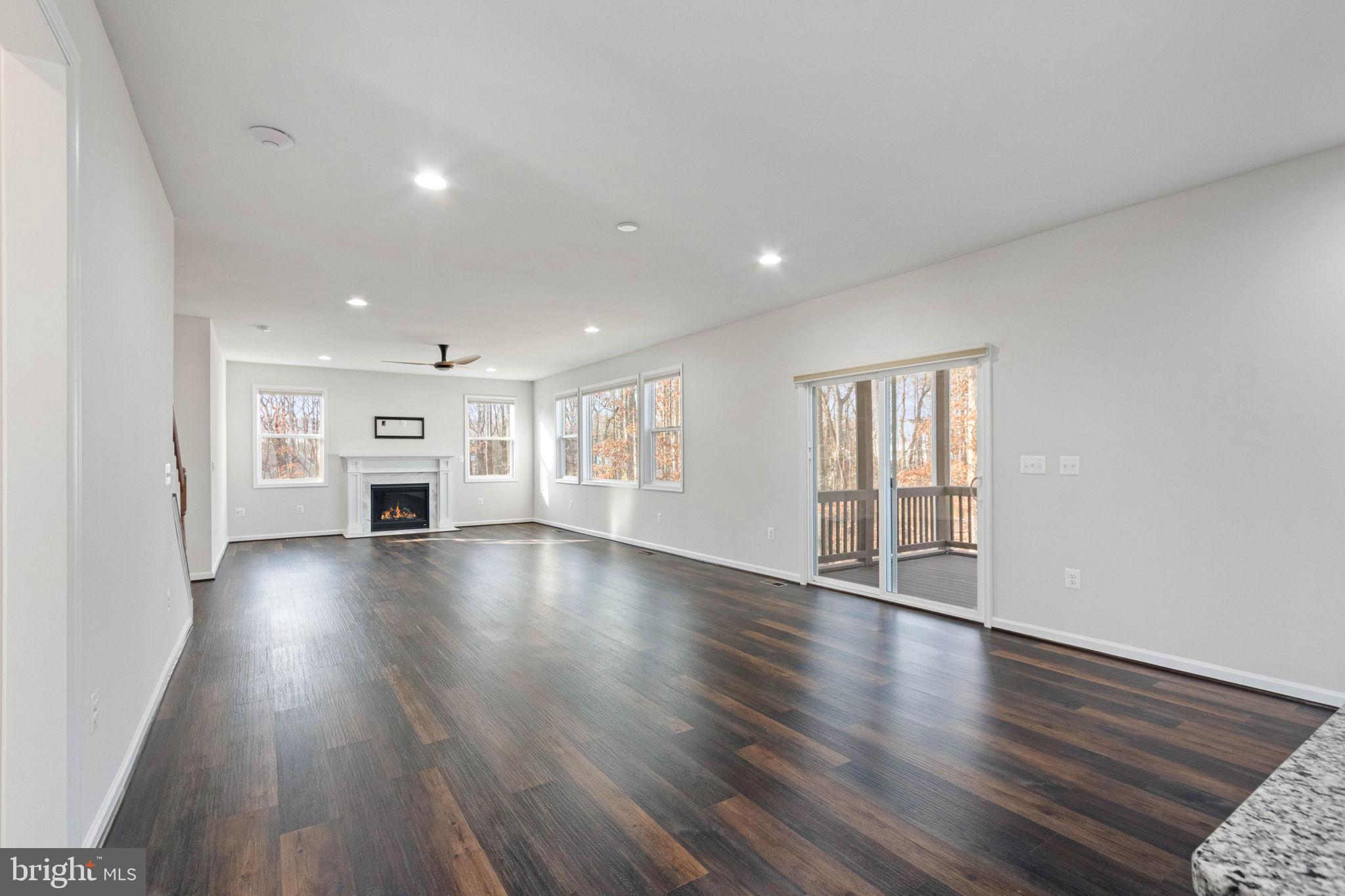 10602 Springvale Lane Spotsylvania, VA 22551 - Photo 20 of 92 a view of empty room with wooden floor and window