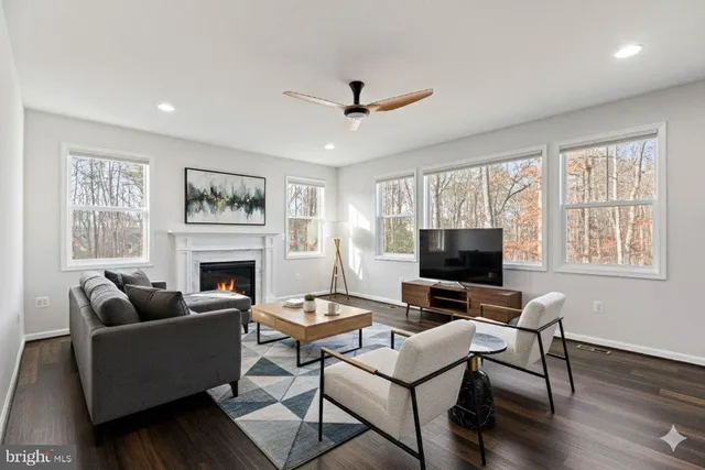 a bathroom with a sink a toilet and a window