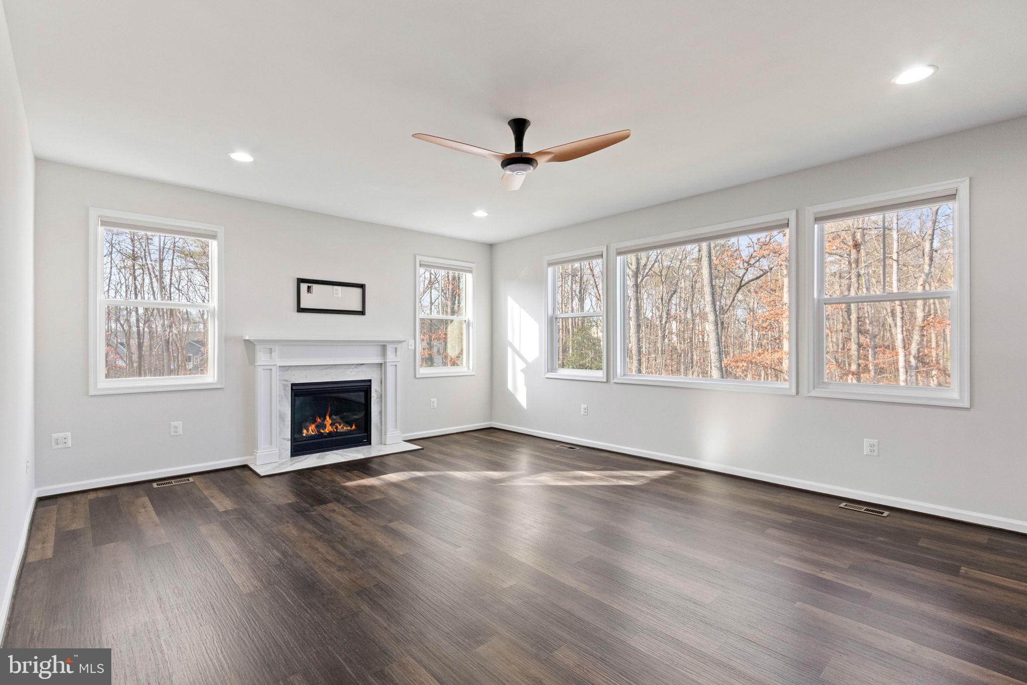 10602 Springvale Lane Spotsylvania, VA 22551 - Photo 23 of 92 a view of an empty room with wooden floor and a window