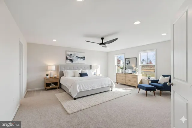 a spacious bathroom with a granite countertop sink a mirror and a shower