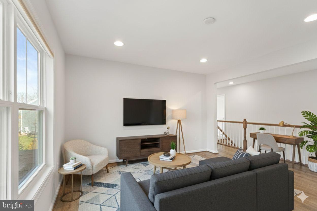 10602 Springvale Lane Spotsylvania, VA 22551 - Photo 49 of 92 a living room with furniture and a flat screen tv