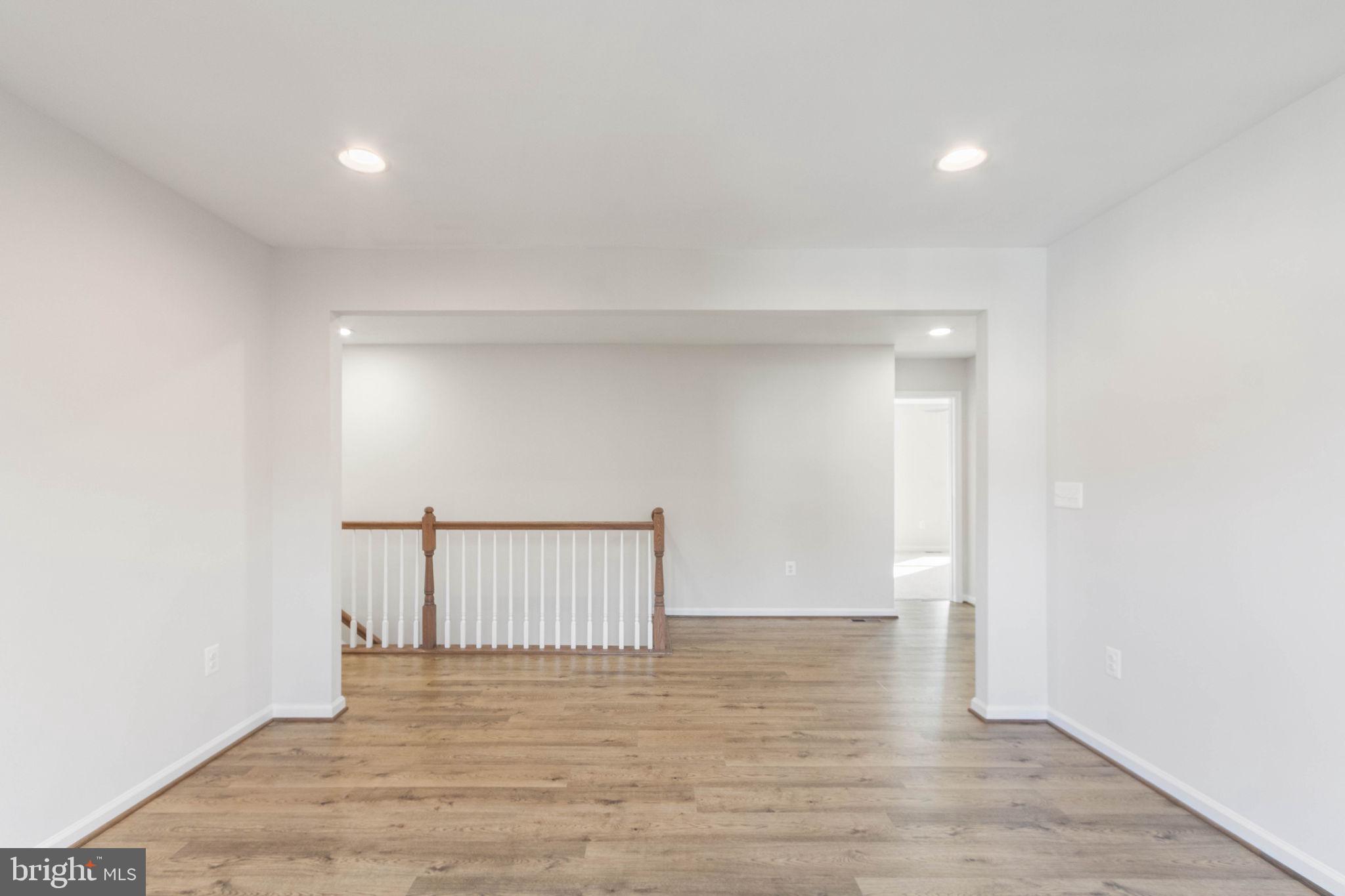 10602 Springvale Lane Spotsylvania, VA 22551 - Photo 50 of 92 a view of an empty room with wooden floor
