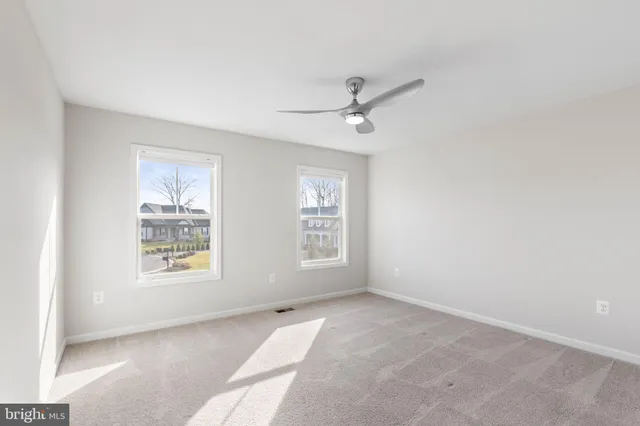 a view of a house with backyard and deck