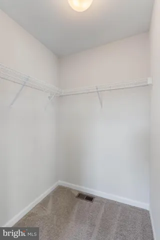 a view of a lake with houses in the back