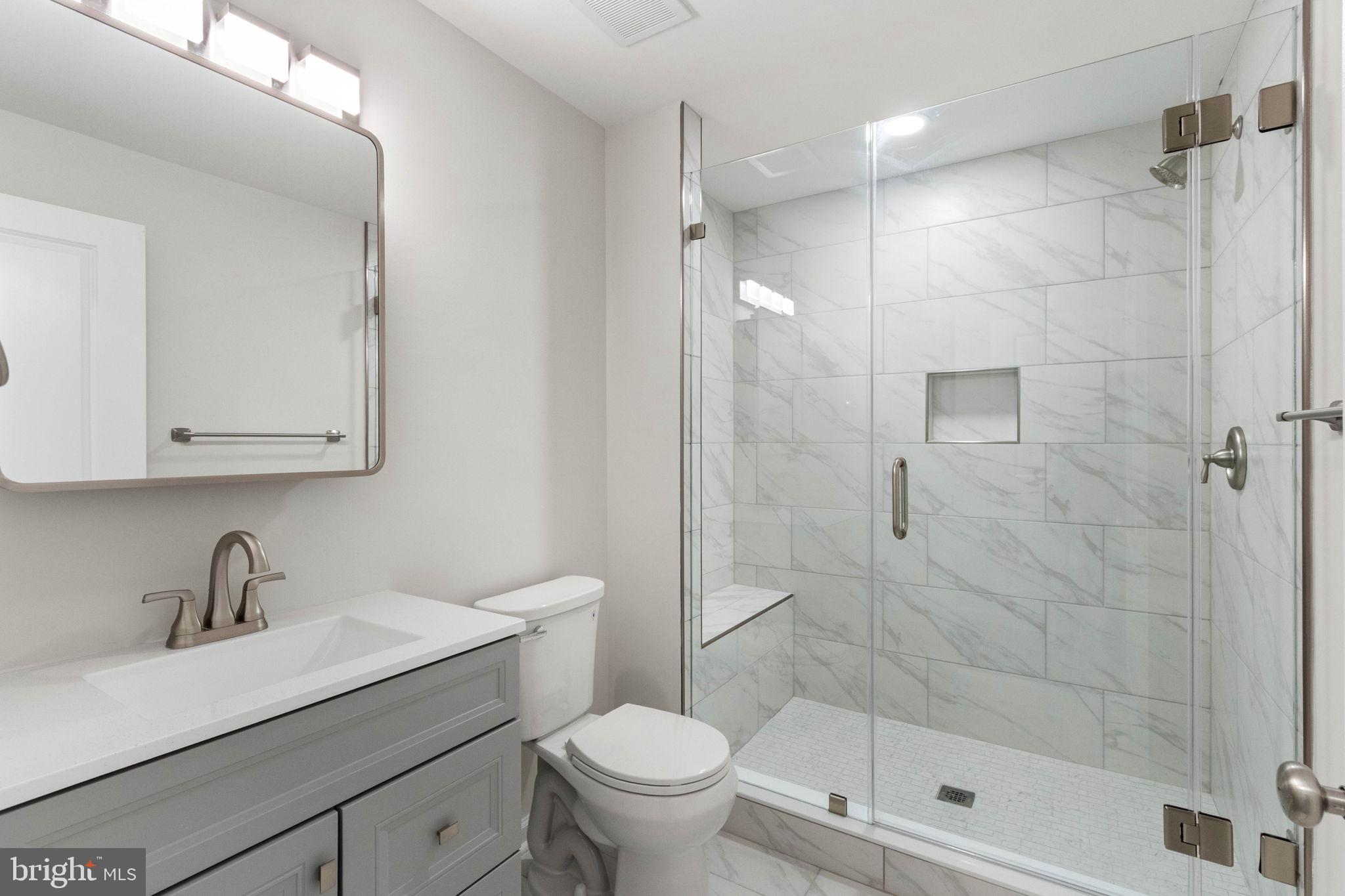 10602 Springvale Lane Spotsylvania, VA 22551 - Photo 65 of 92 a bathroom with a sink a toilet and shower