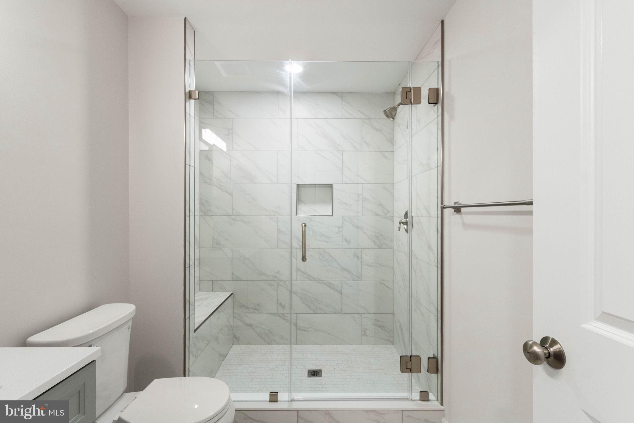 10602 Springvale Lane Spotsylvania, VA 22551 - Photo 66 of 92 a bathroom with a shower a toilet and a shower