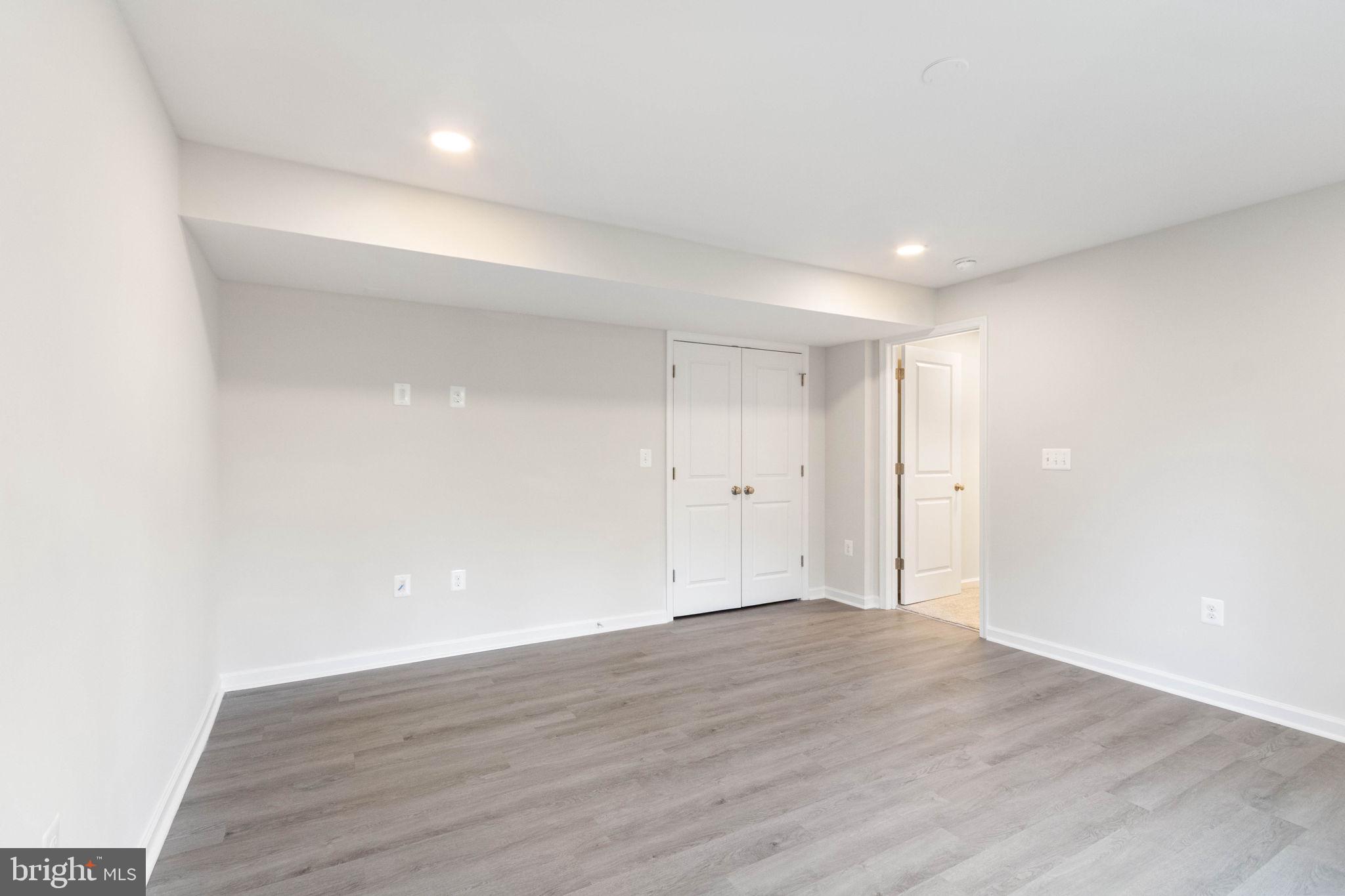 10602 Springvale Lane Spotsylvania, VA 22551 - Photo 68 of 92 a view of an empty room with wooden floor