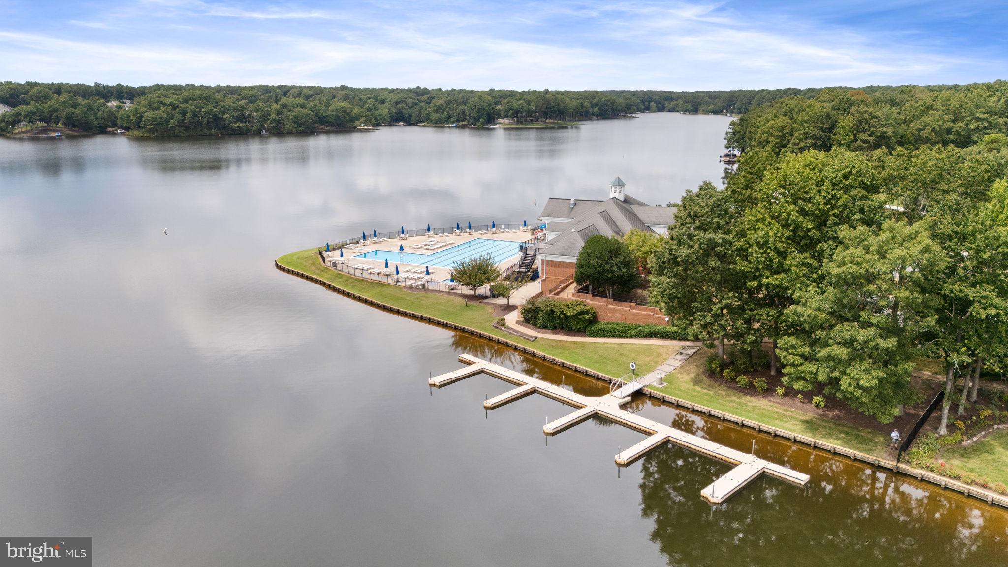 10602 Springvale Lane Spotsylvania, VA 22551 - Photo 88 of 92 a view of a lake with houses in the back