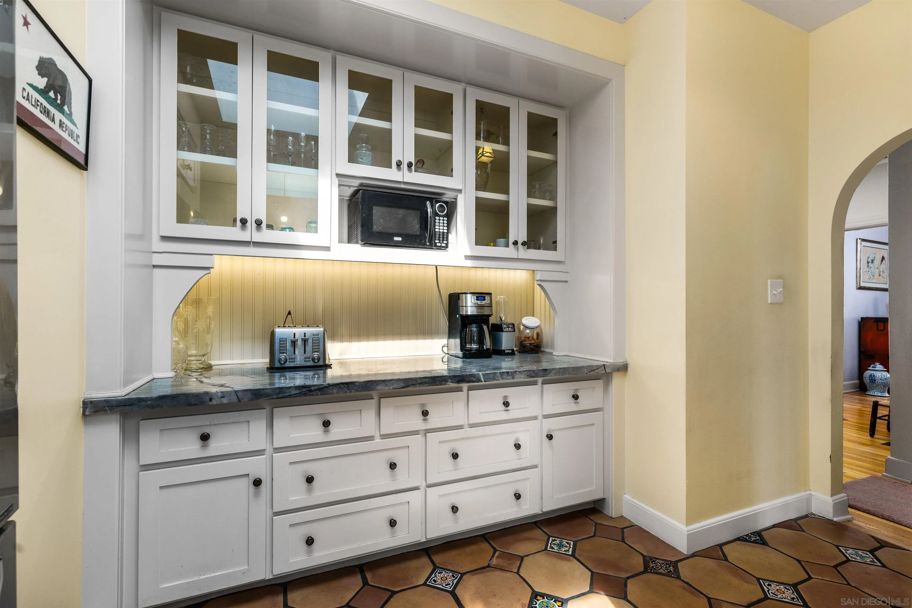4192 Rochester Road San Diego, CA 92116 - Photo 16 of 38 a bathroom with a granite countertop sink and a mirror