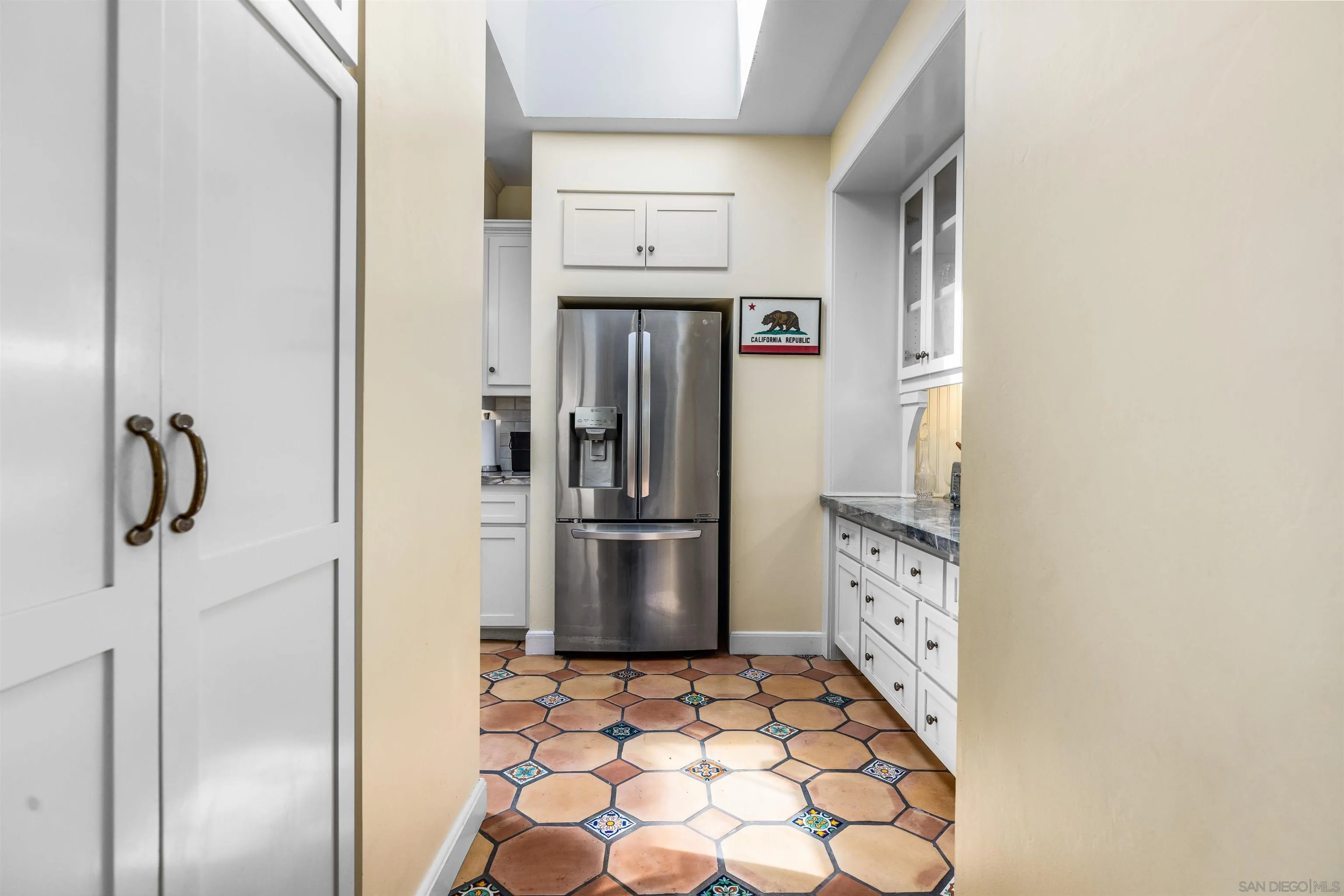 4192 Rochester Road San Diego, CA 92116 - Photo 17 of 38 a kitchen with stainless steel appliances granite countertop a refrigerator and a sink