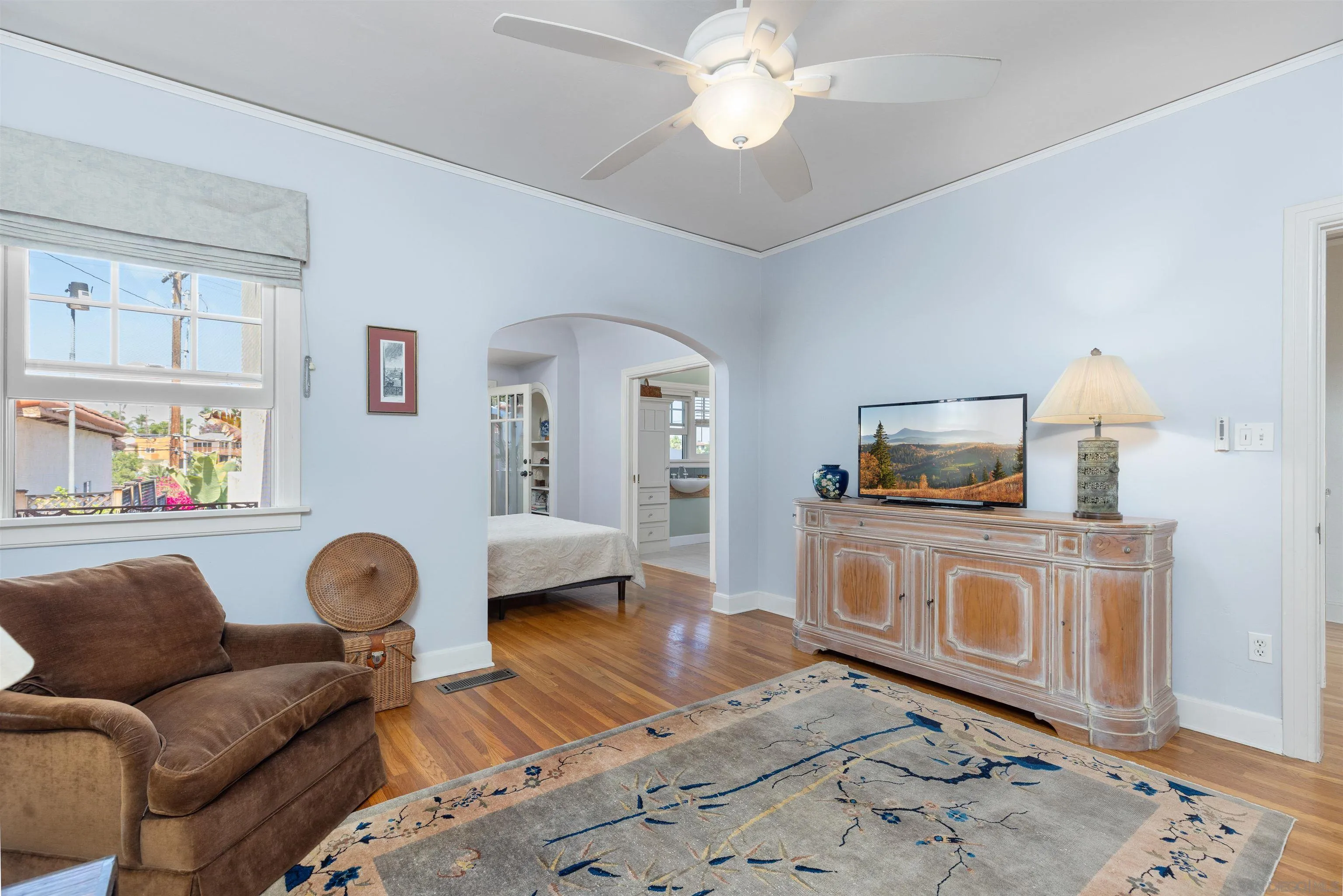 4192 Rochester Road San Diego, CA 92116 - Photo 20 of 38 a living room with furniture a flat screen tv and a stove