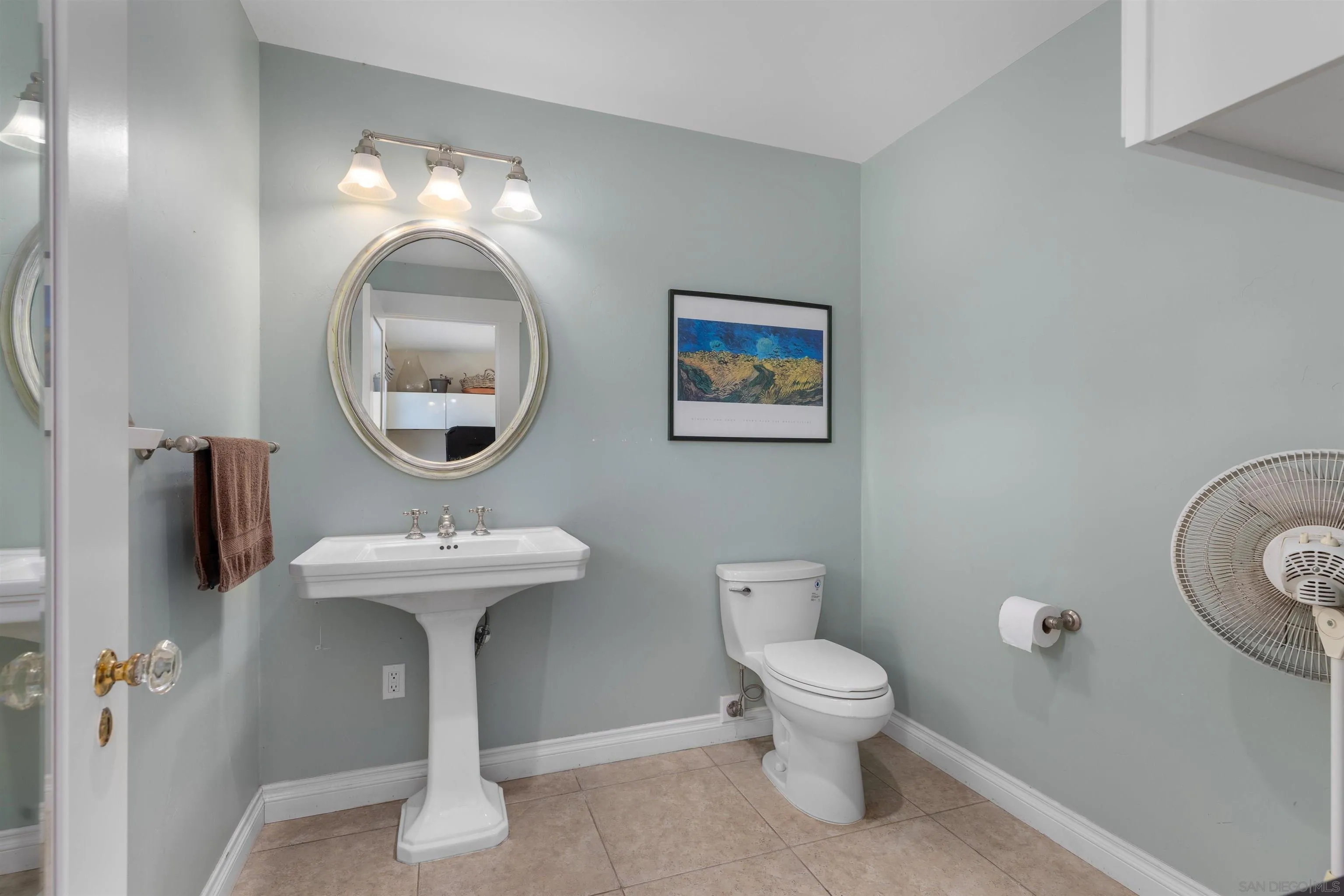 4192 Rochester Road San Diego, CA 92116 - Photo 27 of 38 a bathroom with a toilet sink and mirror