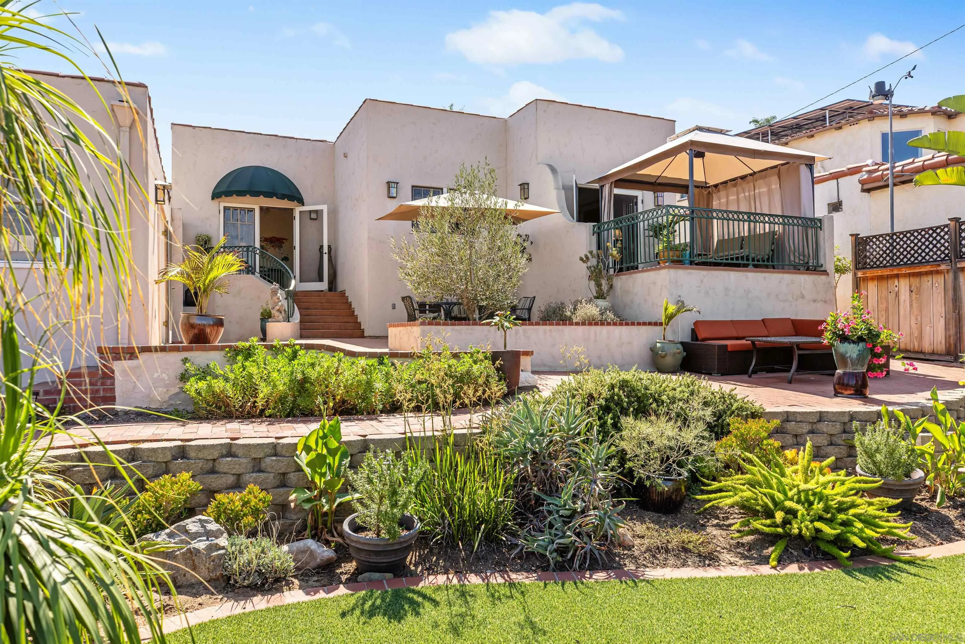 4192 Rochester Road San Diego, CA 92116 - Photo 35 of 38 a front view of a house with a yard