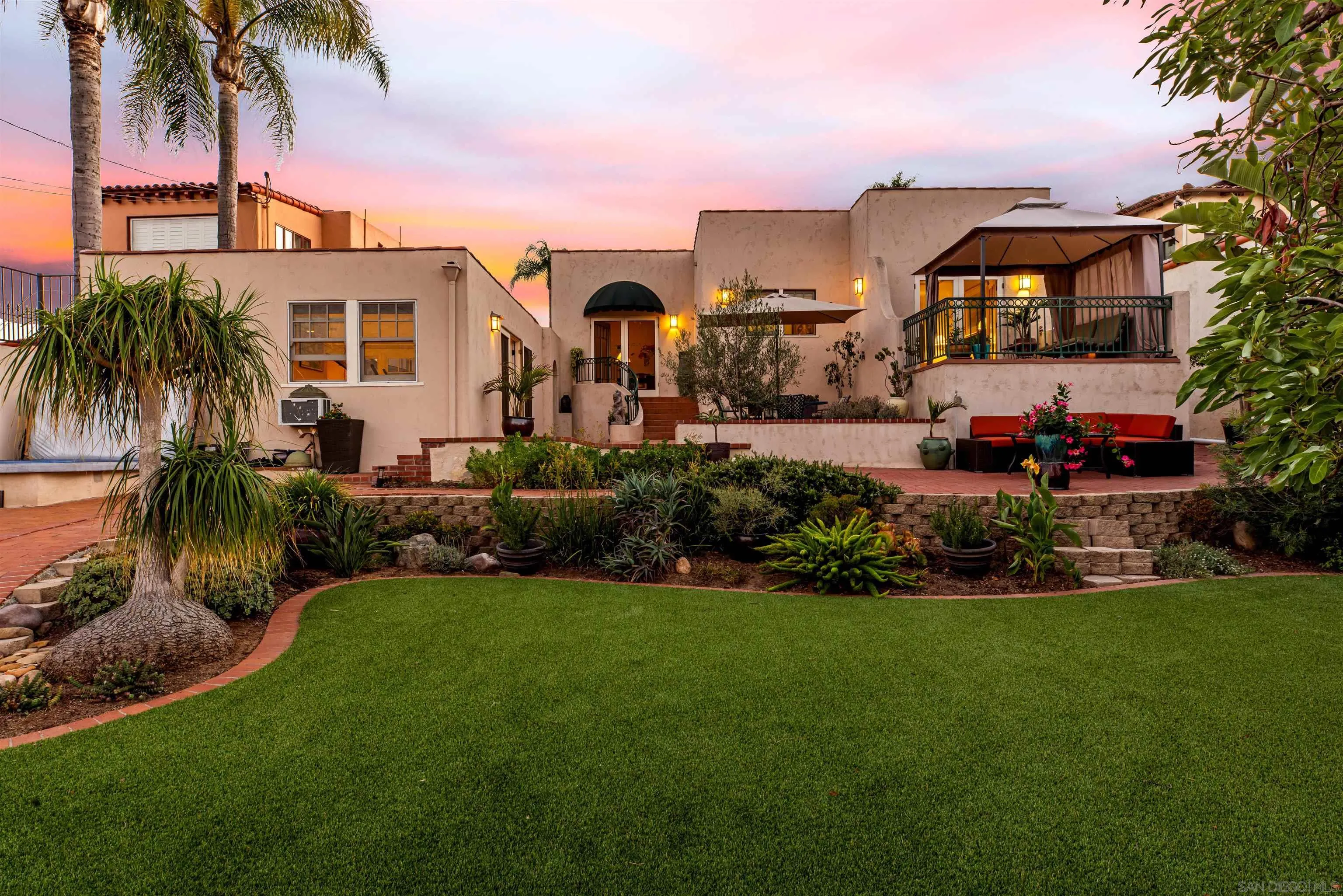 4192 Rochester Road San Diego, CA 92116 - Photo 38 of 38 a front view of a house with a garden and patio