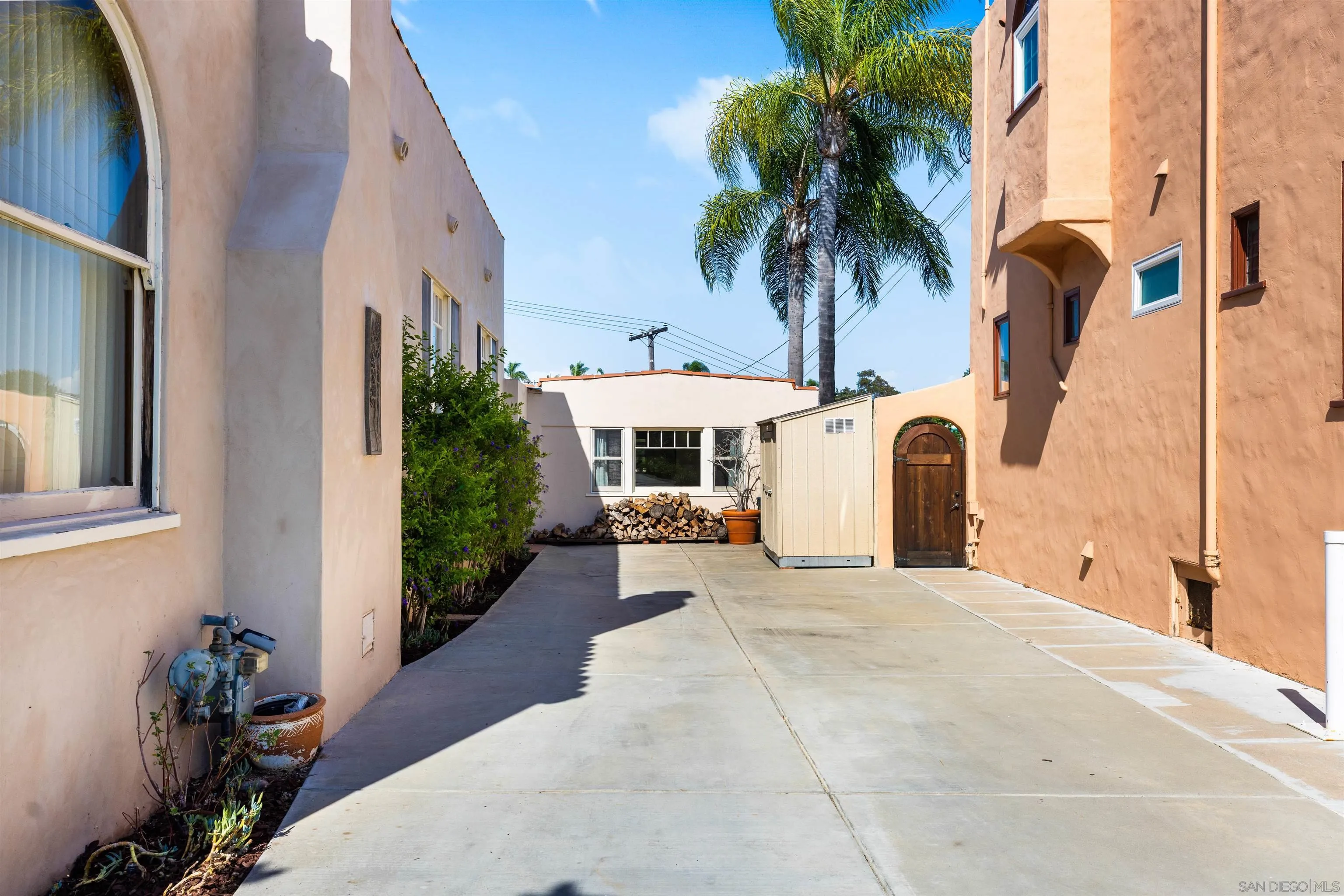 4192 Rochester Road San Diego, CA 92116 - Photo 9 of 38 a white house with palm tree in front of it