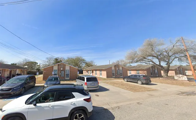 a view of street with parked cars