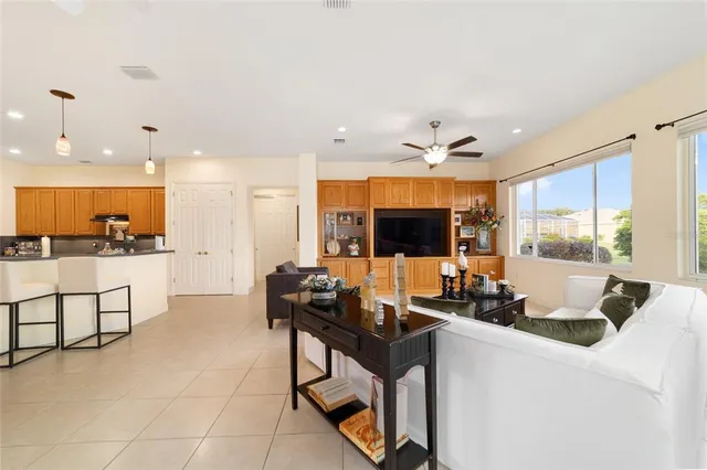 a large room with a large window and furniture