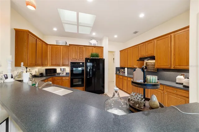 a view of a porch with furniture and garden