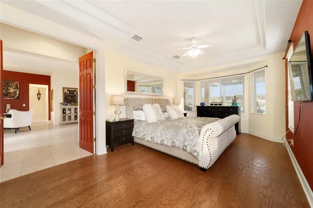 a front view of a house with a yard and potted plants