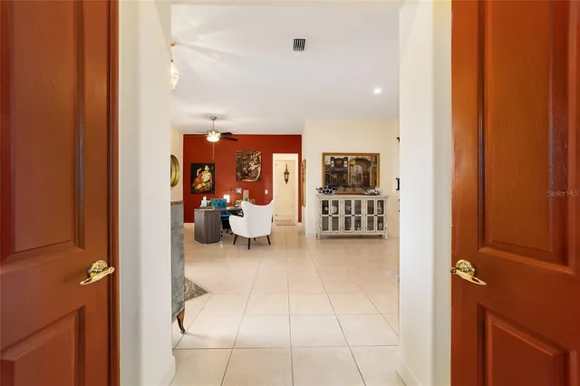 a view of a lake with houses in the background