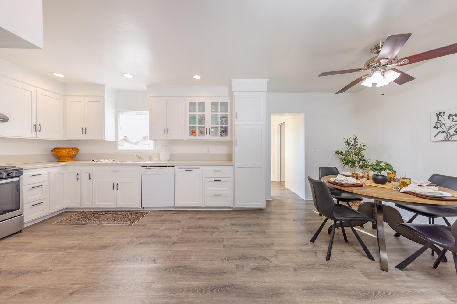 755 Spring Street Oak View, CA 93022 - Photo 13 of 29 a kitchen with stainless steel appliances kitchen island granite countertop a table chairs sink and cabinets