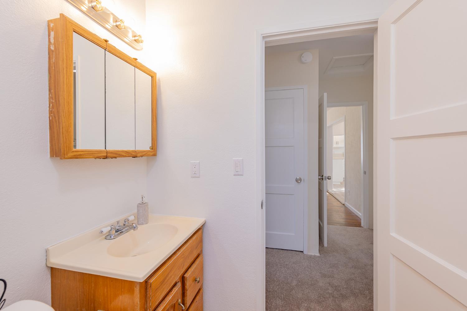 755 Spring Street Oak View, CA 93022 - Photo 16 of 29 a bathroom with a sink and a mirror