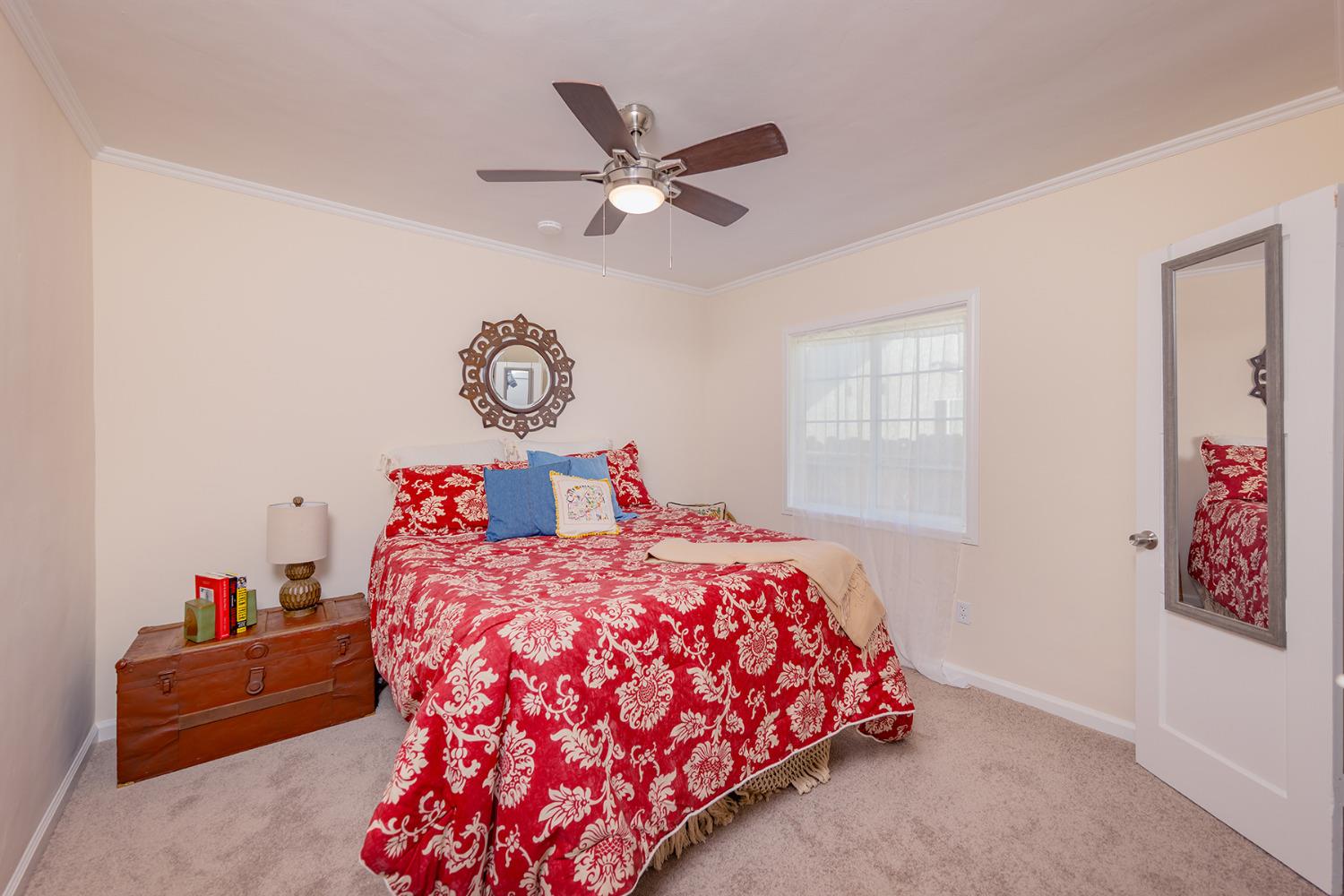 755 Spring Street Oak View, CA 93022 - Photo 17 of 29 a bedroom with bed and a chandelier