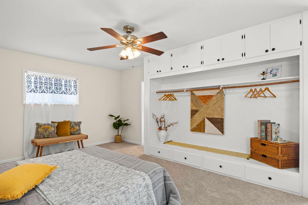 755 Spring Street Oak View, CA 93022 - Photo 19 of 29 a bedroom with a bed and a chandelier