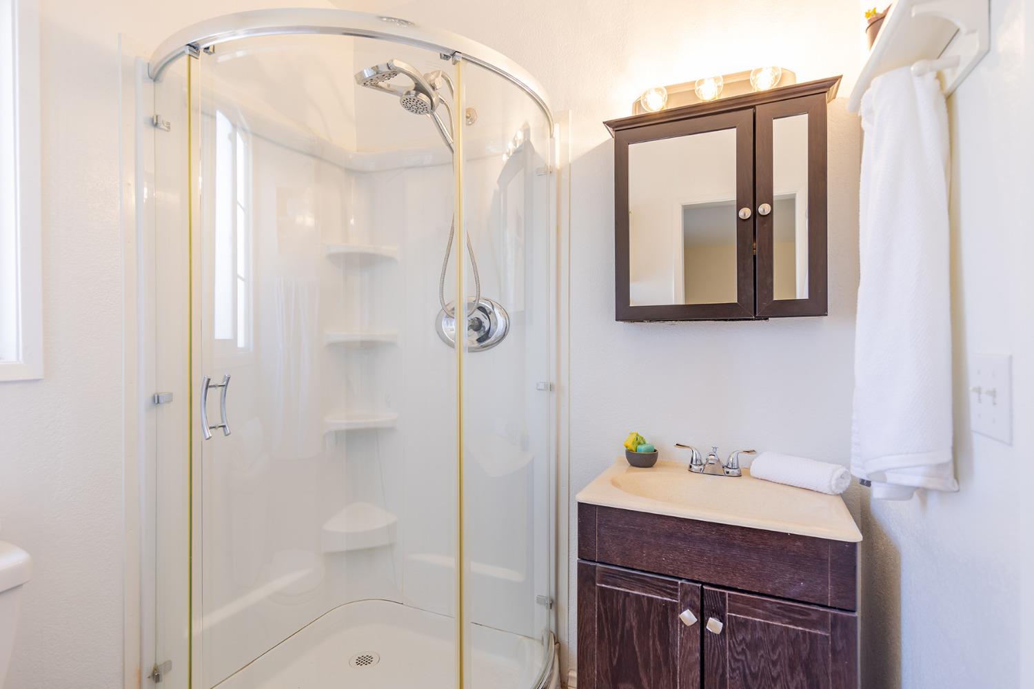 755 Spring Street Oak View, CA 93022 - Photo 21 of 29 a bathroom with a shower sink and mirror