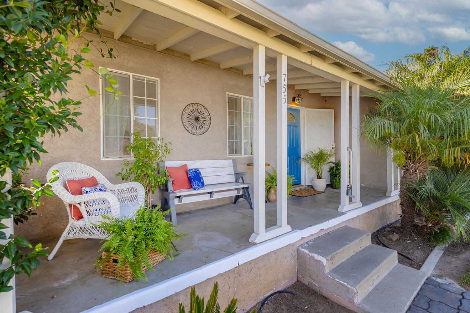 755 Spring Street Oak View, CA 93022 - Photo 4 of 29 a front view of a house with outdoor seating and plants