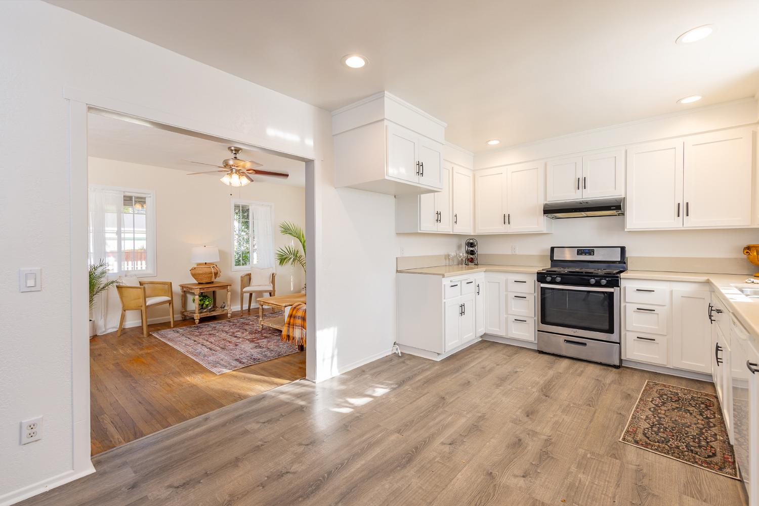 755 Spring Street Oak View, CA 93022 - Photo 10 of 29 a kitchen with granite countertop a stove a sink and a refrigerator