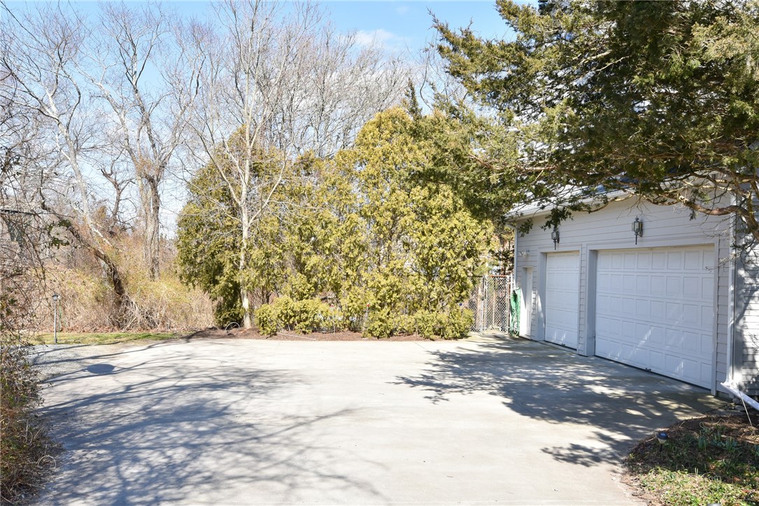 20 Grey Gull Road Jamestown, RI 02835 - Photo 38 of 40 Did I mention there was a 3 car Garage? And it has access to the lower level and interior of house? There's a smart waiter, for carrying your groceries or whatever you choose!