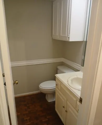 a bathroom with a sink and toilet