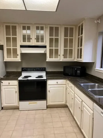a kitchen with a stove and a sink