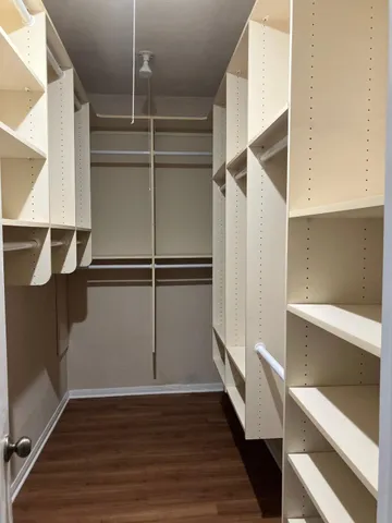 a view of an empty walk in closet