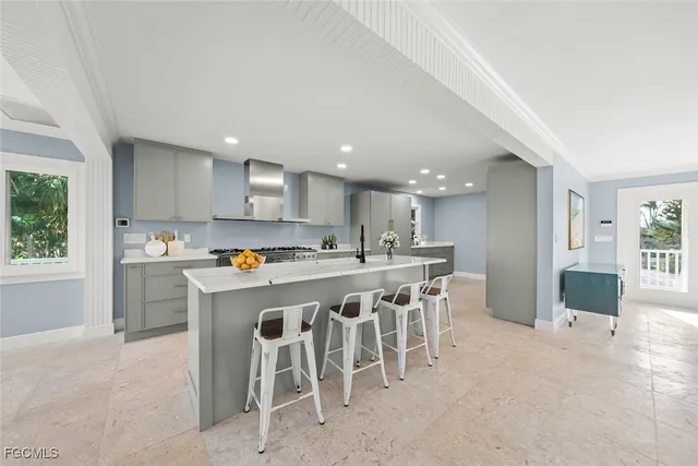 a large kitchen with a table and chairs in it