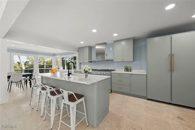 a kitchen with kitchen island granite countertop wooden cabinets and counter space